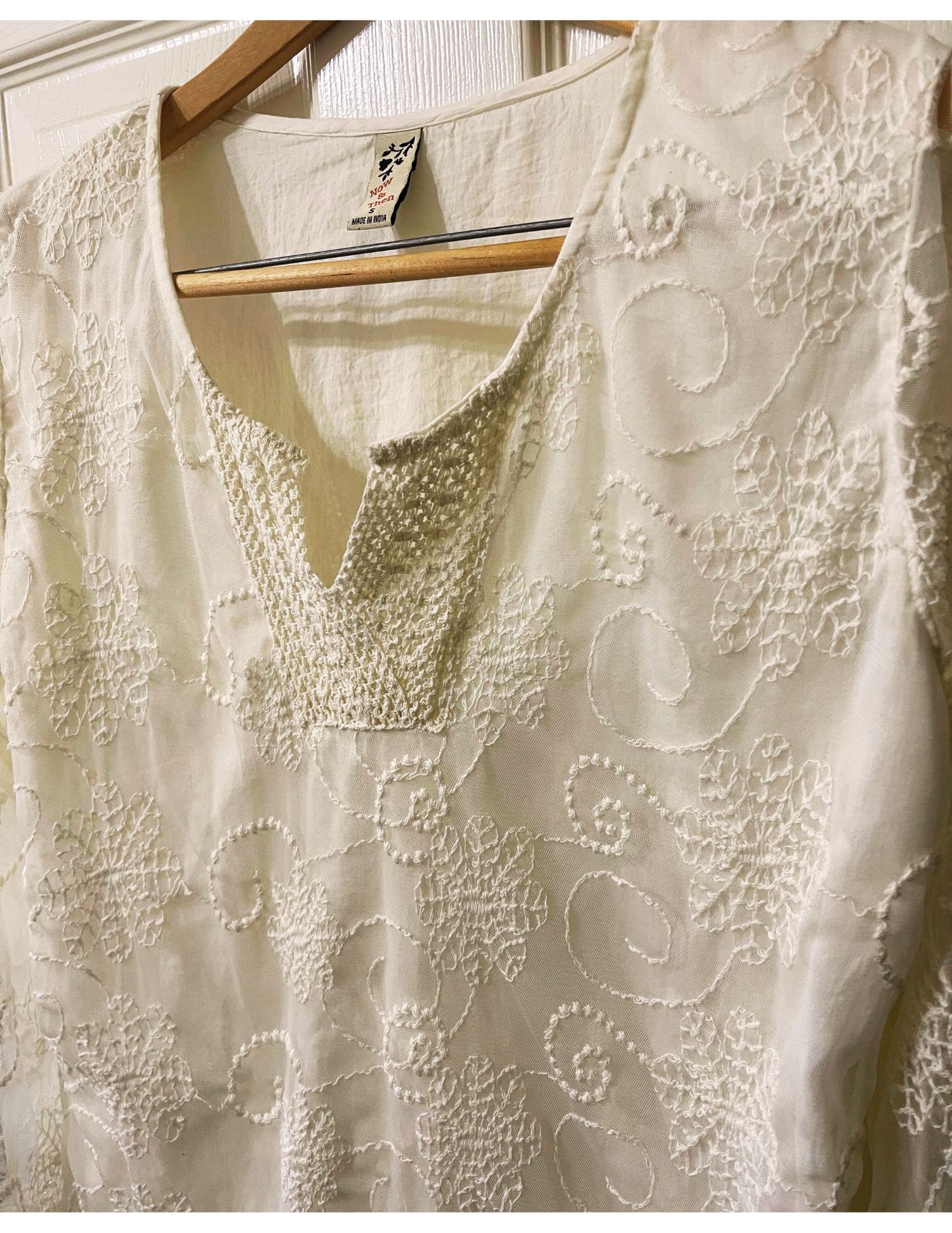 cream embroidered sheer shirt with delicate lining. long sleeved sheer sleeves