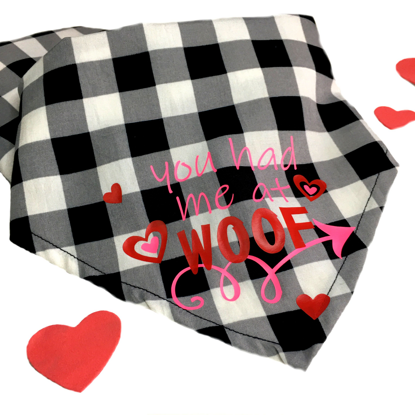 black and white checked dog bandana with pink and red lettering and hearts. "you had me at woof"
