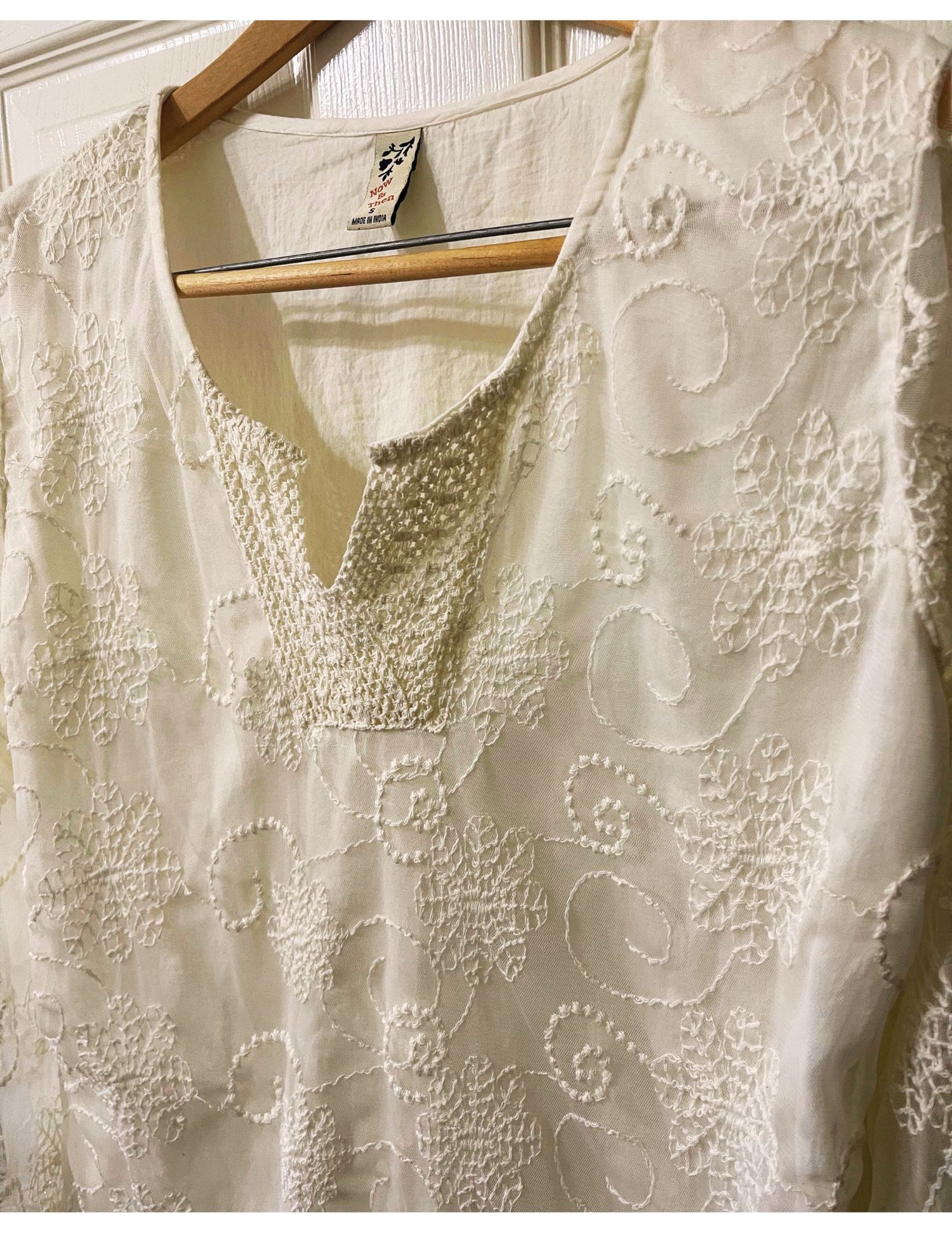 cream embroidered sheer shirt with delicate lining.  long sleeved sheer sleeves