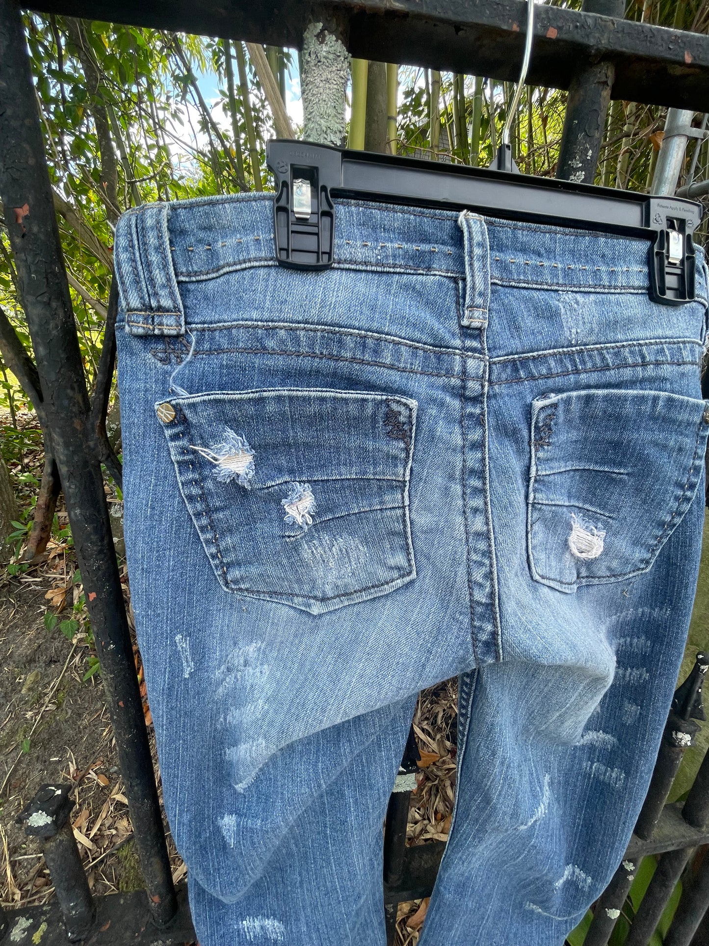 Distressed denim jeans, ankle length jeans, reloved clothing denim