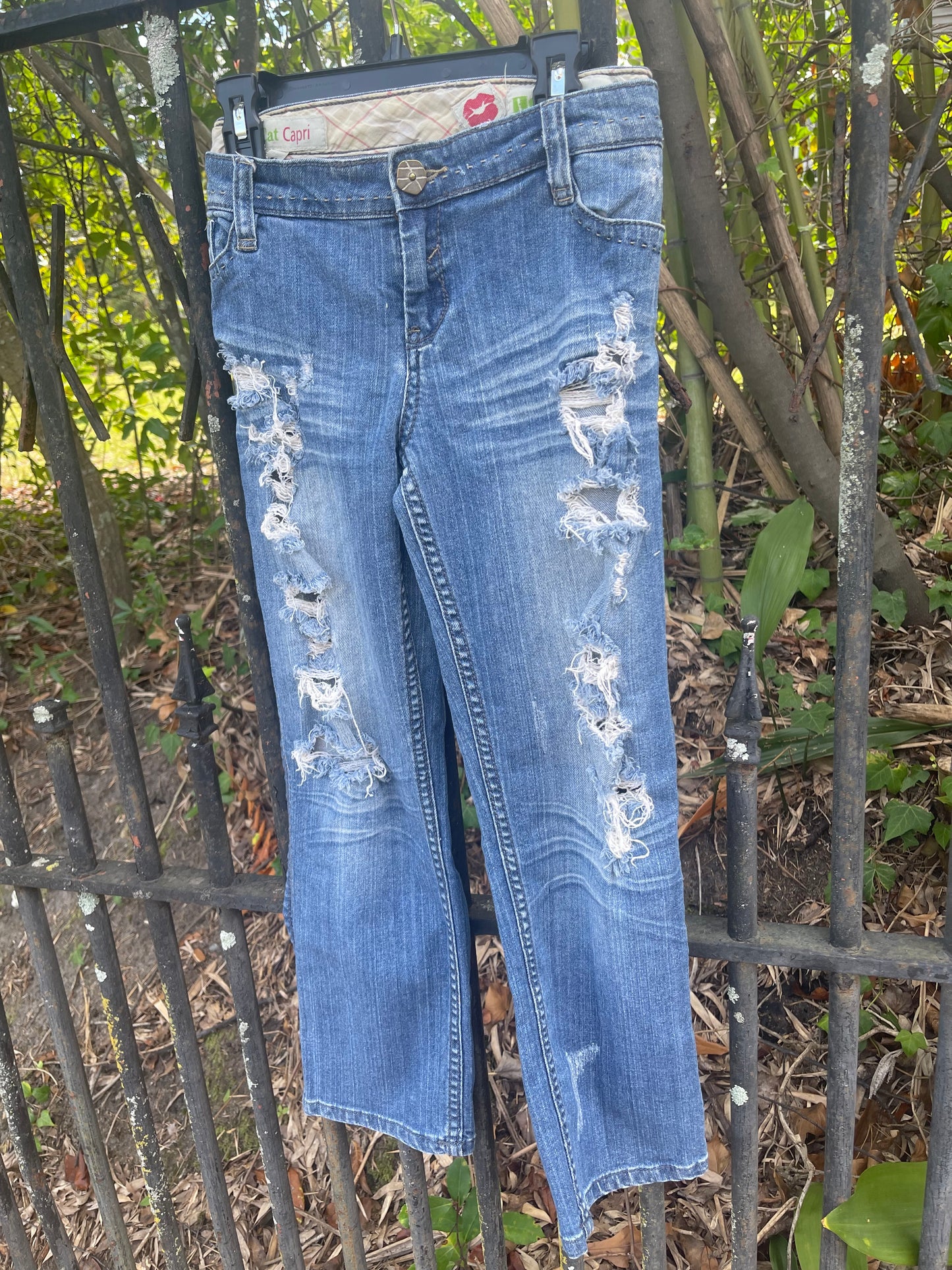 Distressed denim jeans, ankle length jeans, reloved clothing denim
