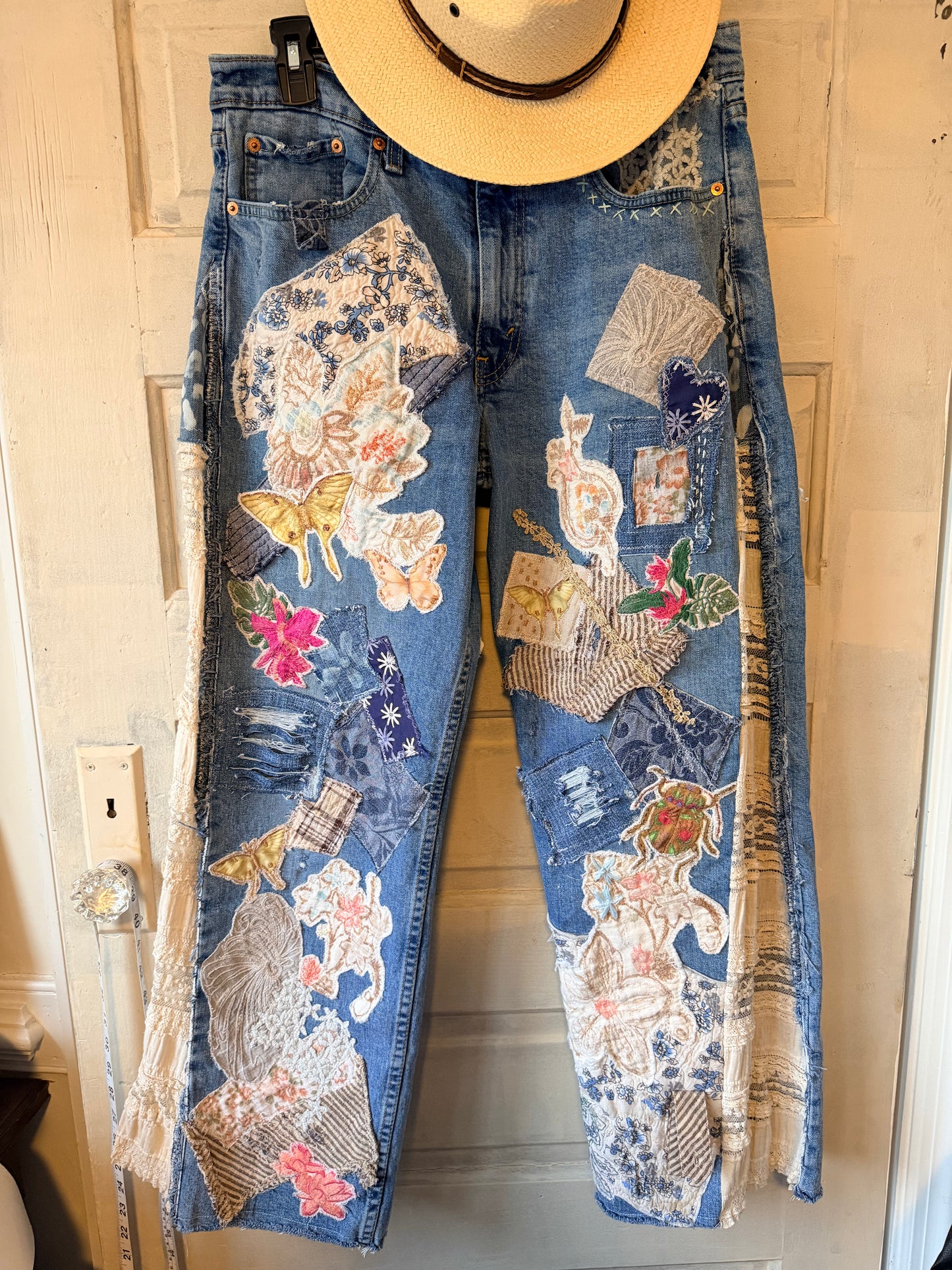 Patchwork upcycled denim jeans, boho hippie style distressed denim, front and frayed jeans