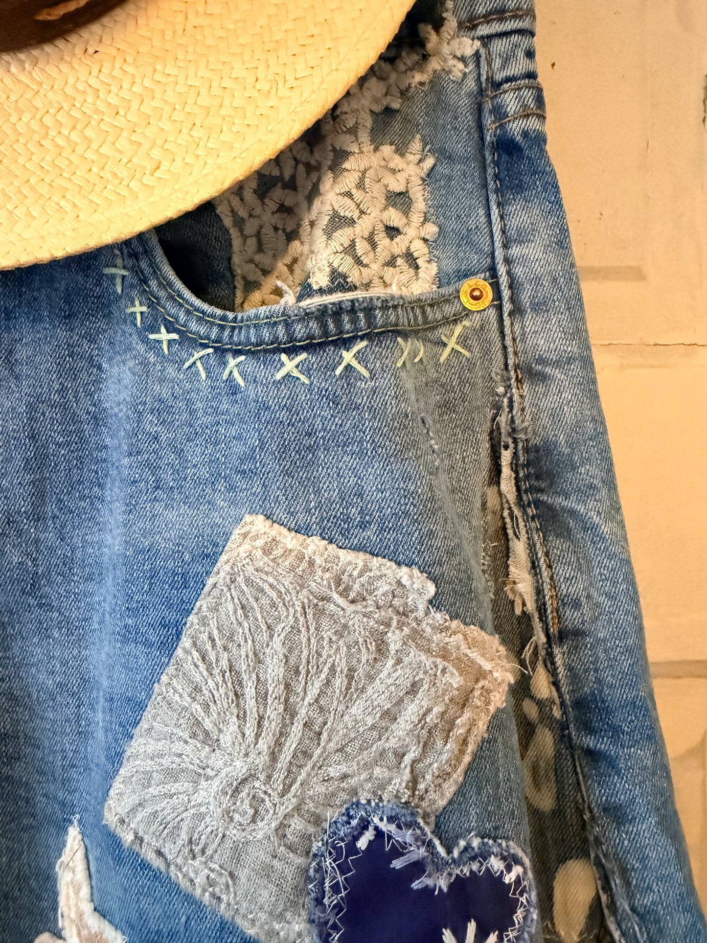 Patchwork upcycled denim jeans, boho hippie style distressed denim, front and frayed jeans