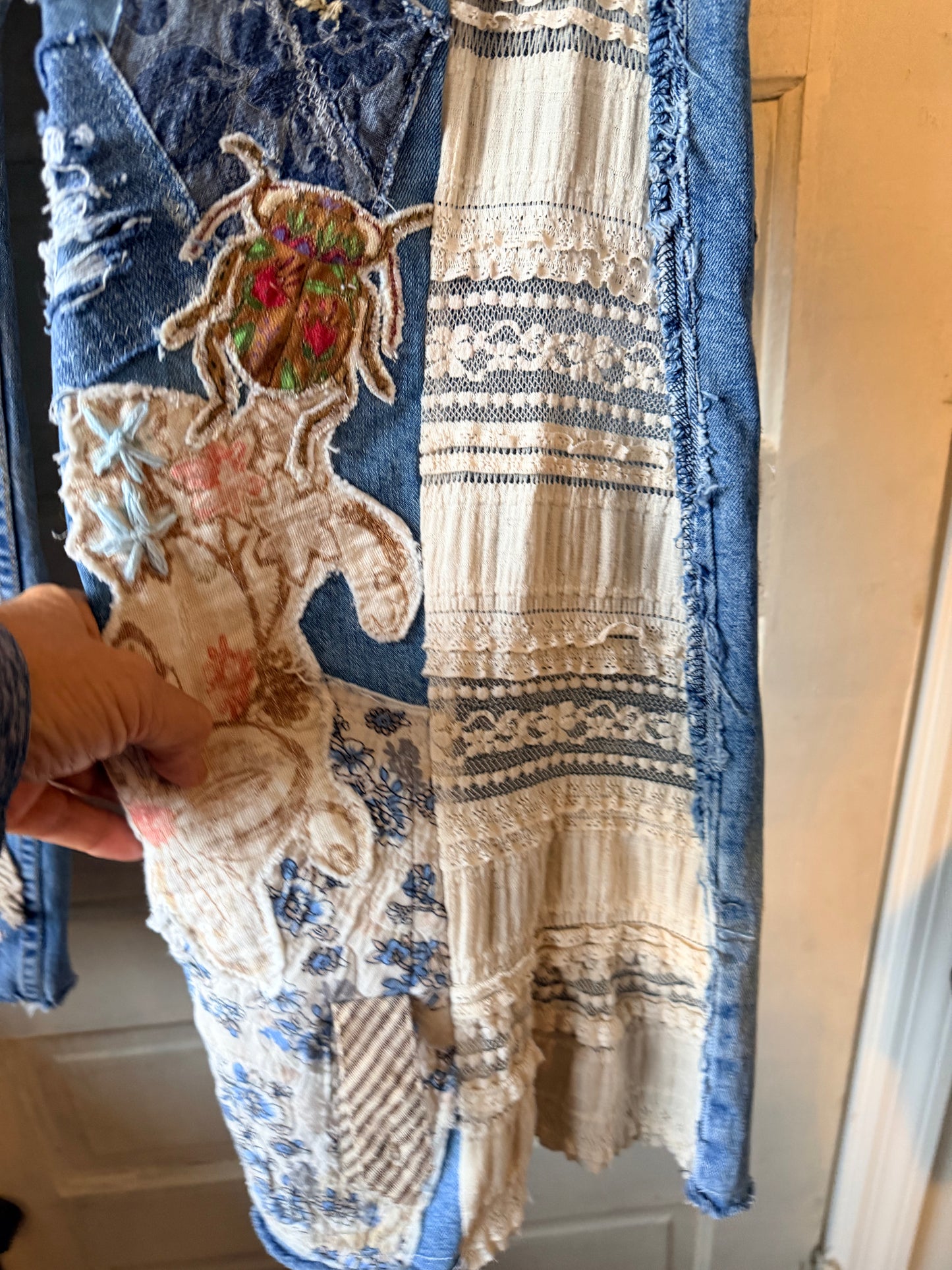 Patchwork upcycled denim jeans, boho hippie style distressed denim, front and frayed jeans