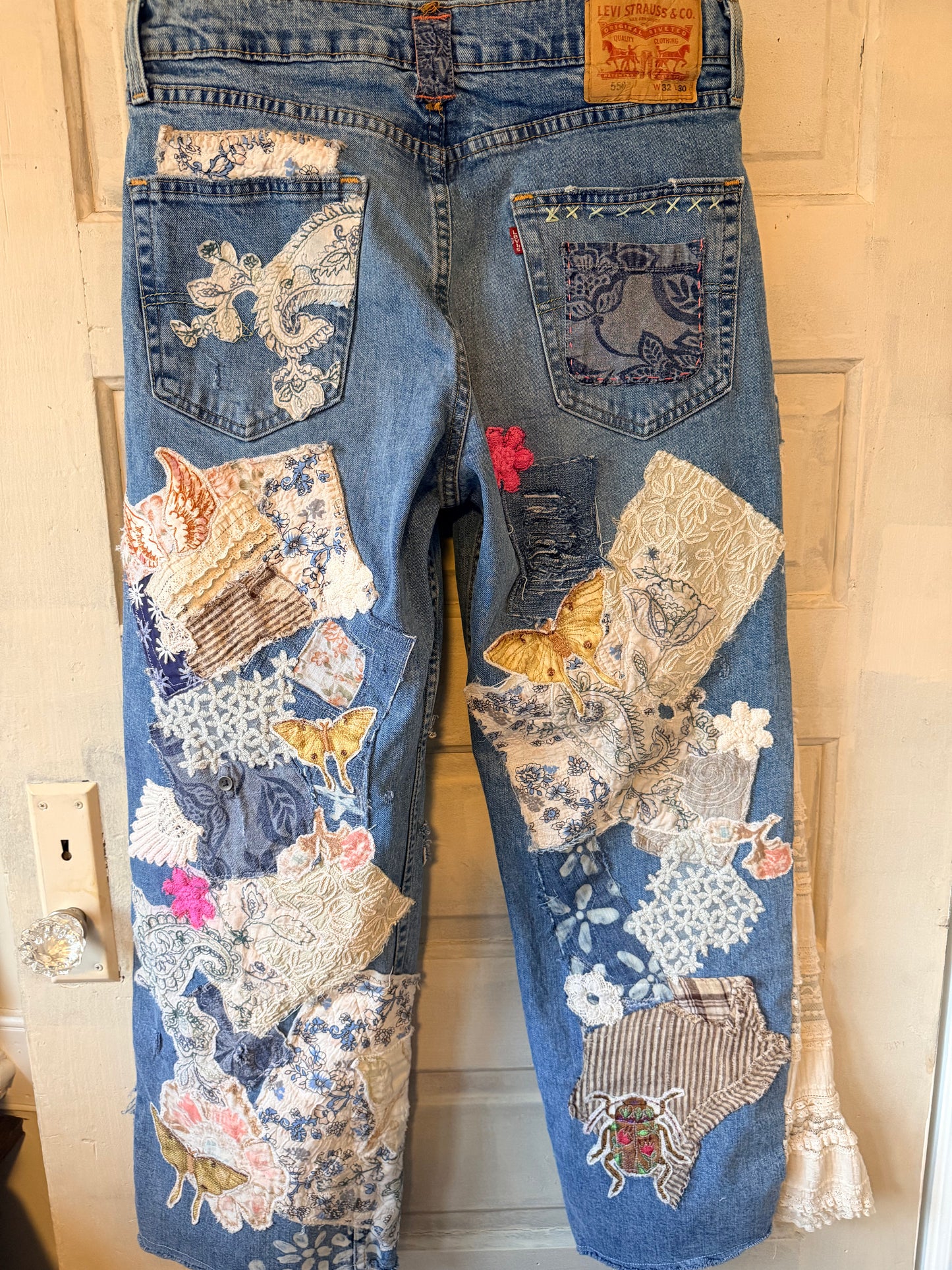 Patchwork upcycled denim jeans, boho hippie style distressed denim, front and frayed jeans