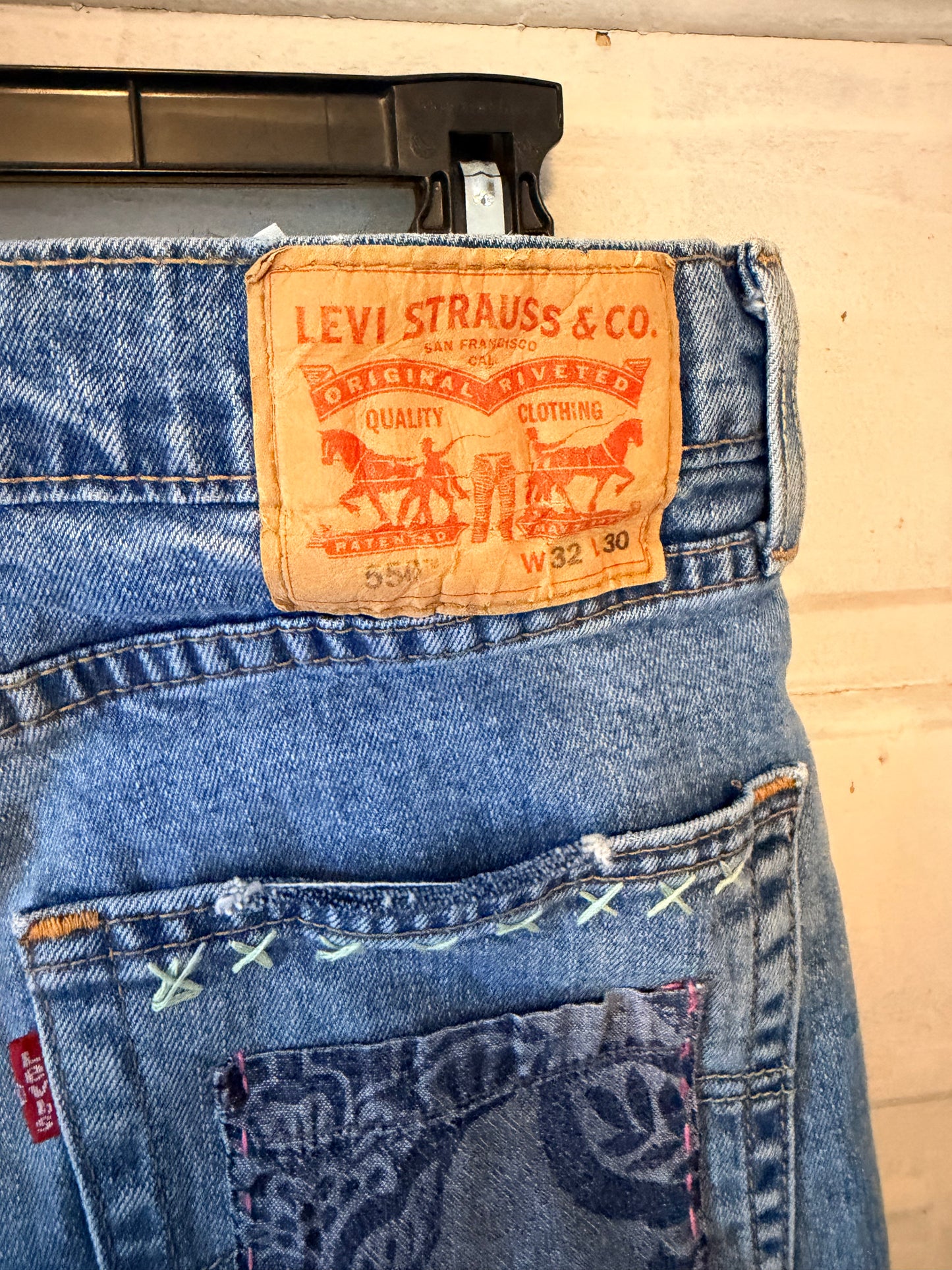 Patchwork upcycled denim jeans, boho hippie style distressed denim, front and frayed jeans