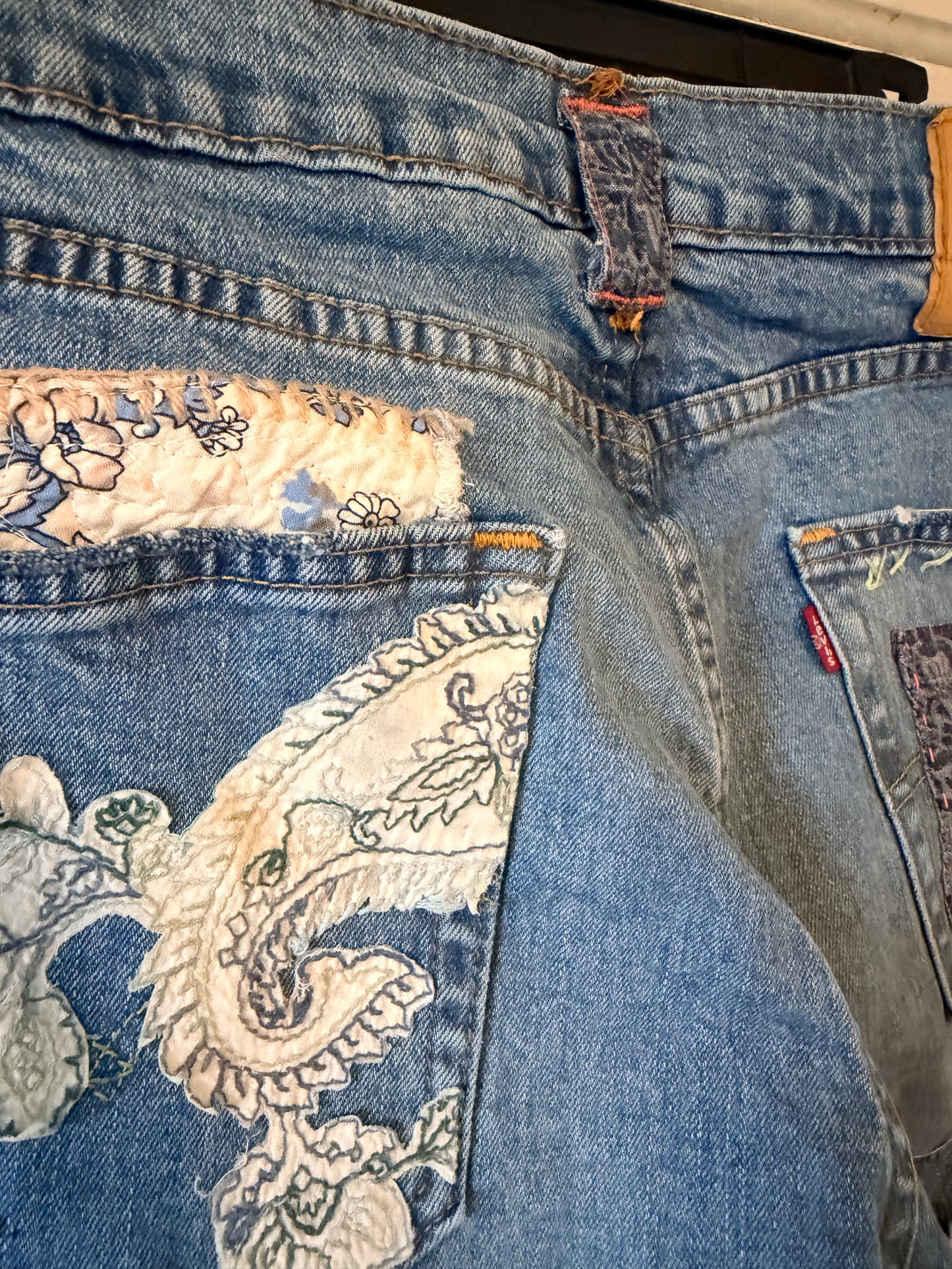 Patchwork upcycled denim jeans, boho hippie style distressed denim, front and frayed jeans