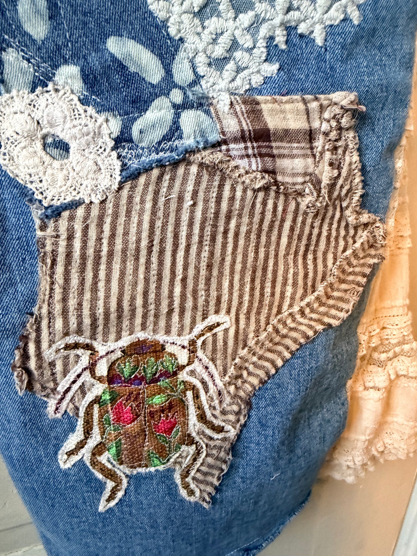 Patchwork upcycled denim jeans, boho hippie style distressed denim, front and frayed jeans