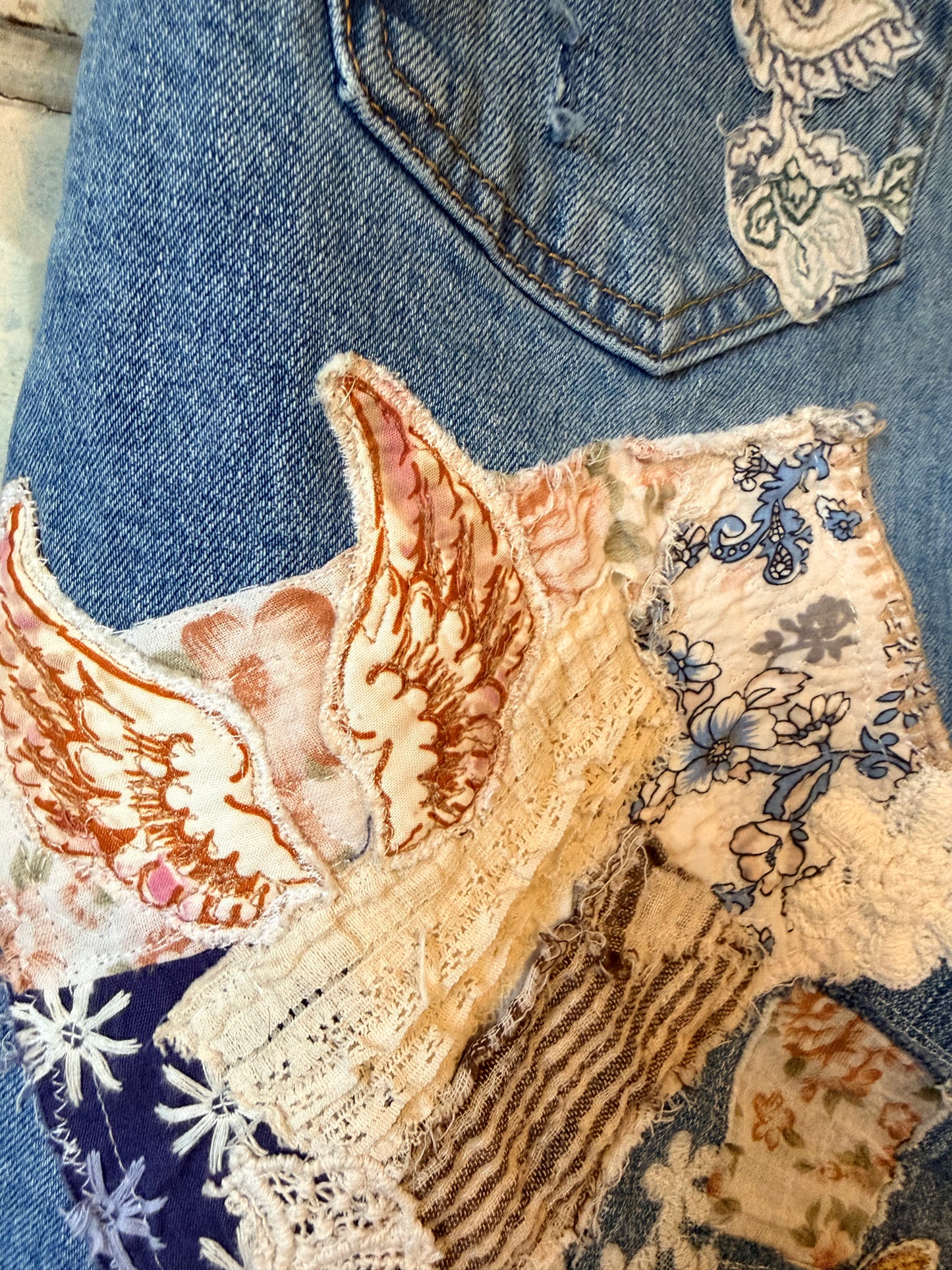 Patchwork upcycled denim jeans, boho hippie style distressed denim, front and frayed jeans