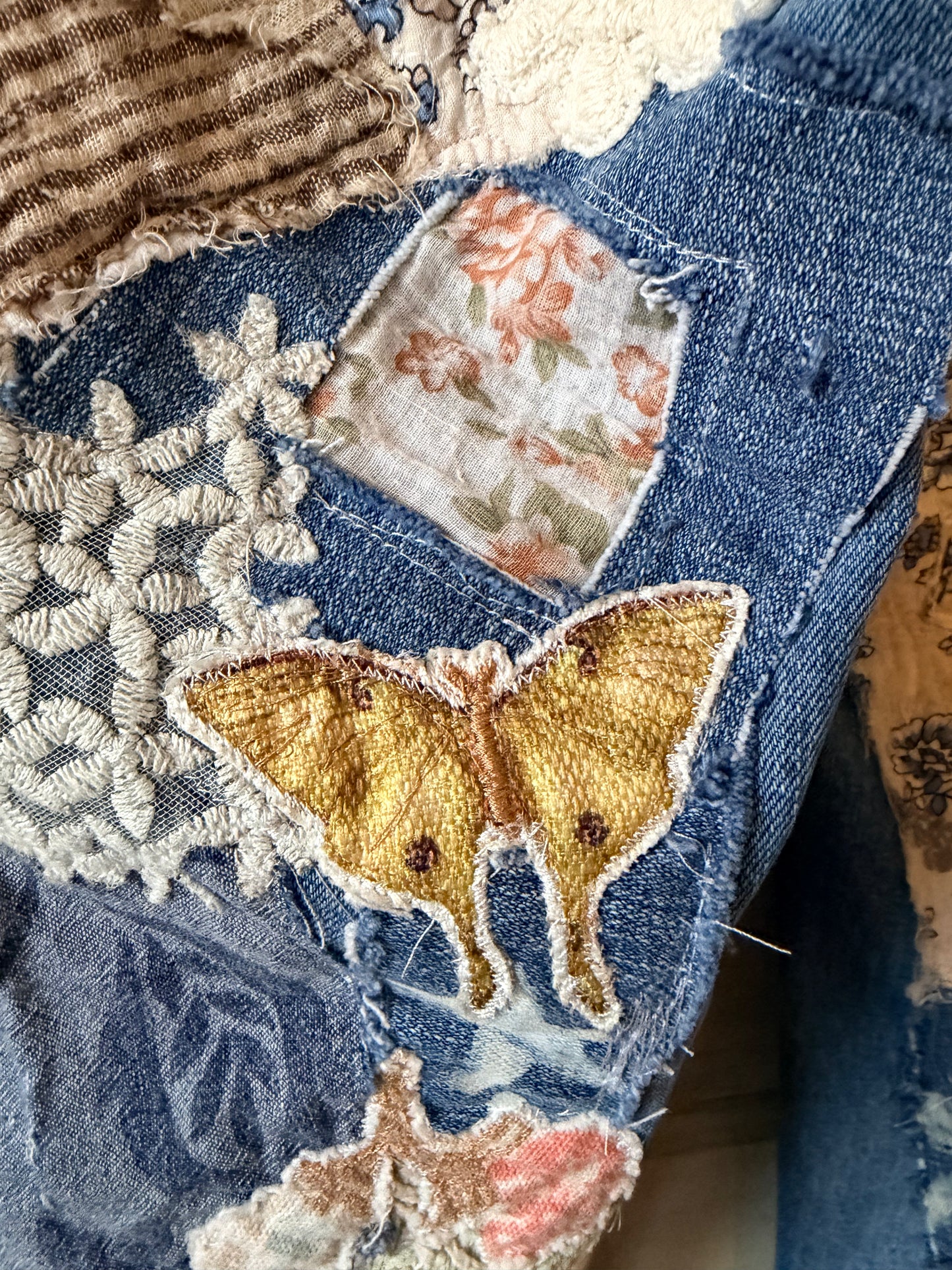Patchwork upcycled denim jeans, boho hippie style distressed denim, front and frayed jeans