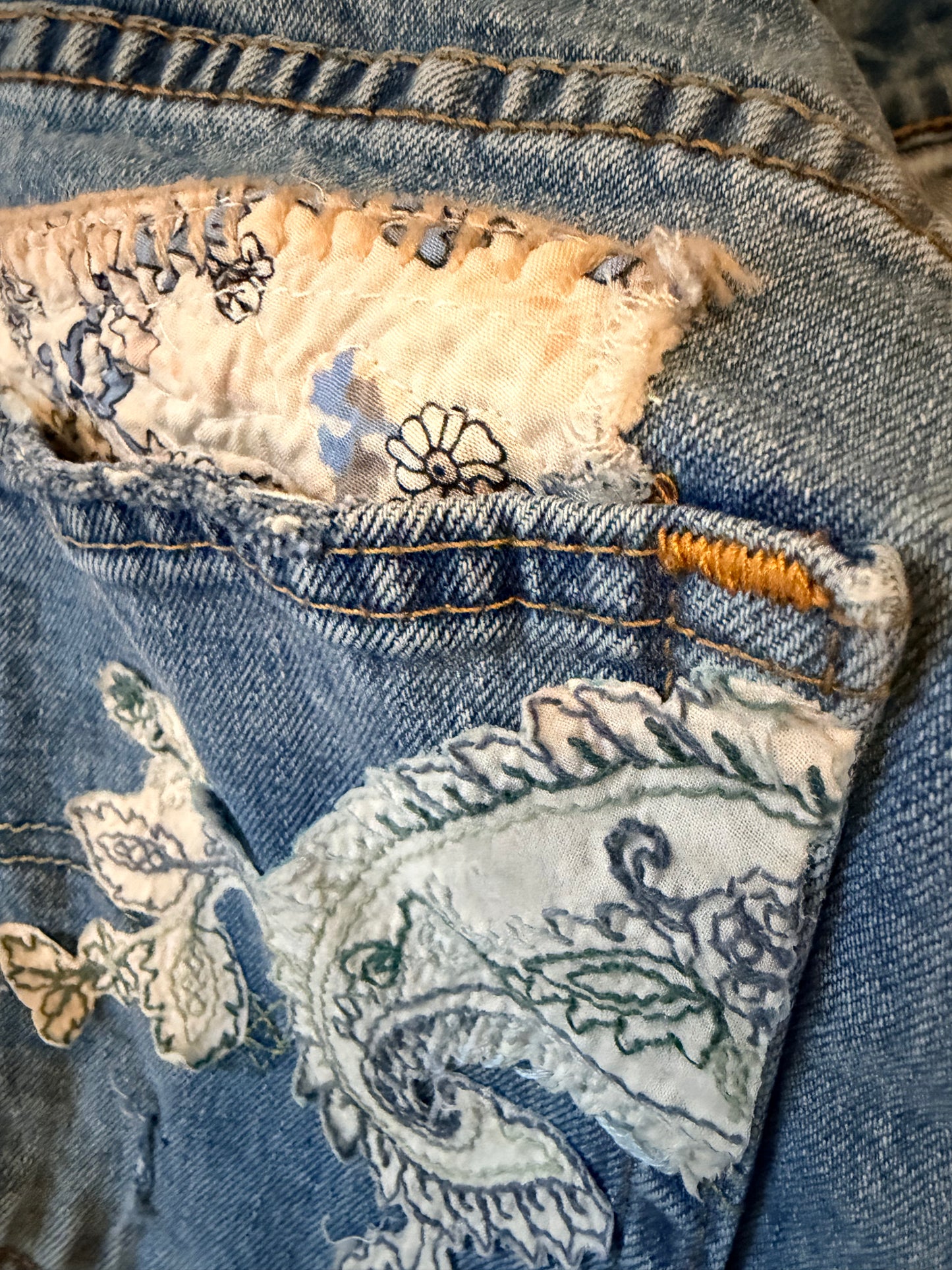 Patchwork upcycled denim jeans, boho hippie style distressed denim, front and frayed jeans